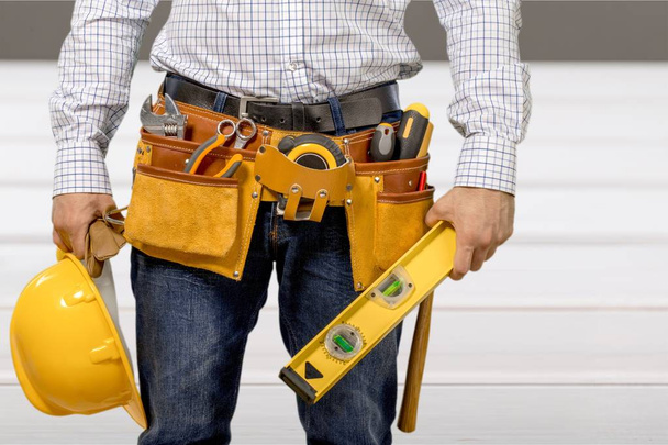 Worker with a tool belt - Foto, Imagem