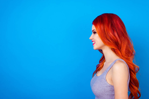 Side profile portrait of a sexy ginger girl, posing and  smiling - Fotografie, Obrázek