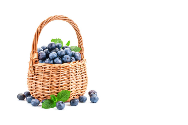 Basket with blueberries isolated on white background. - 写真・画像