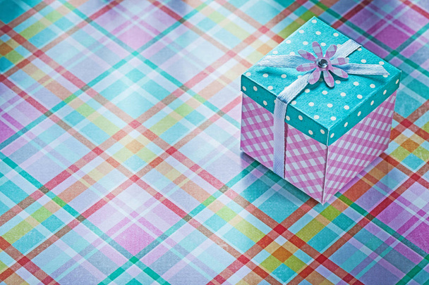 Present box on checked fabric background holidays concept - Foto, Imagem