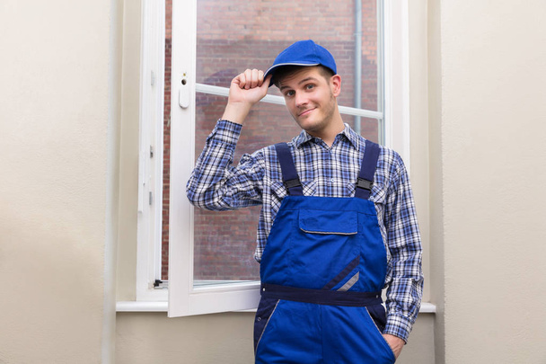 Male Handyman Standing Near Window - Fotoğraf, Görsel