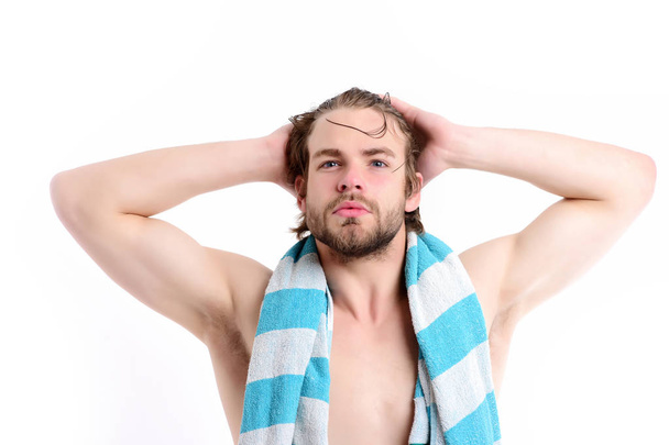 Macho with striped blue towel around neck and big muscles - Zdjęcie, obraz