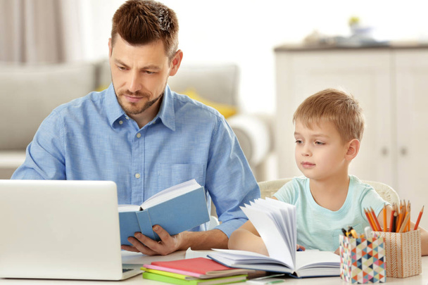 Father and son doing homework - Photo, Image
