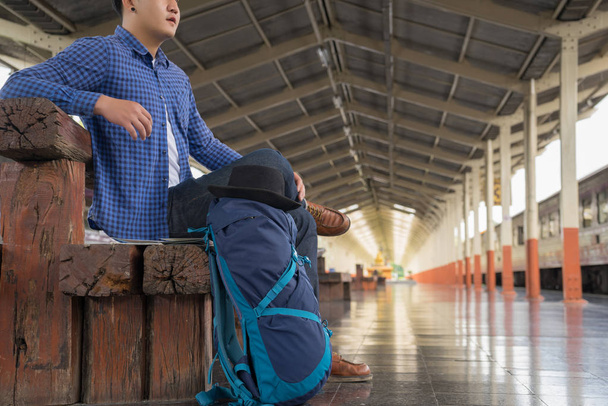man traveler with backpack at train station, travel concept - Photo, Image