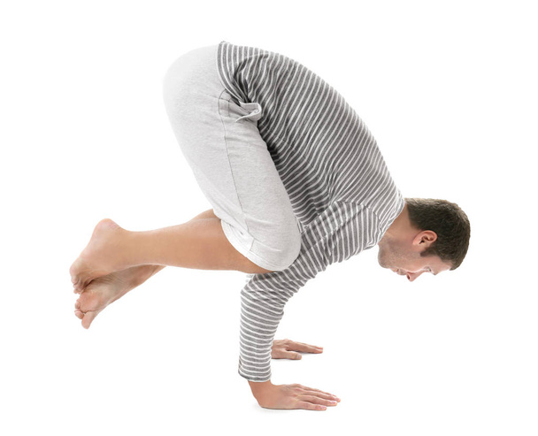 Young man practicing yoga - Fotoğraf, Görsel