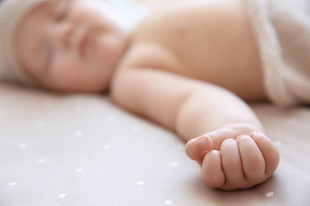 Cute little baby sleeping on bed at home, closeup - 写真・画像