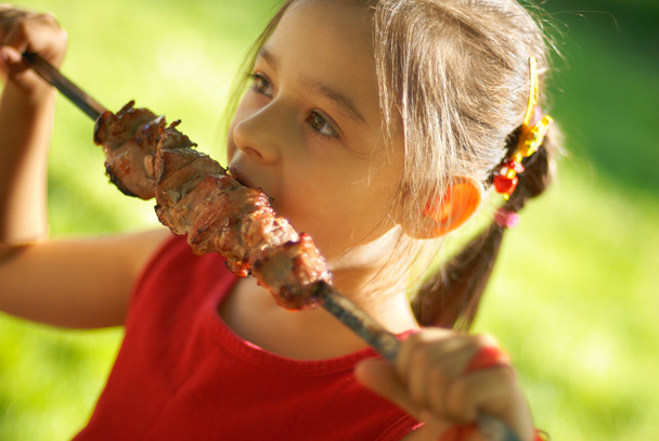 The girl eats a kebab - Photo, Image