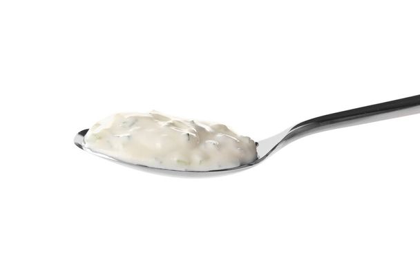 Delicious yogurt sauce in spoon  - Foto, Imagem