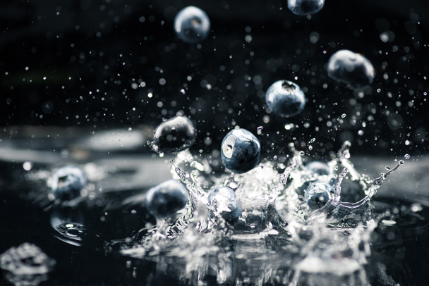 ripe blueberries dropping in water - Photo, Image