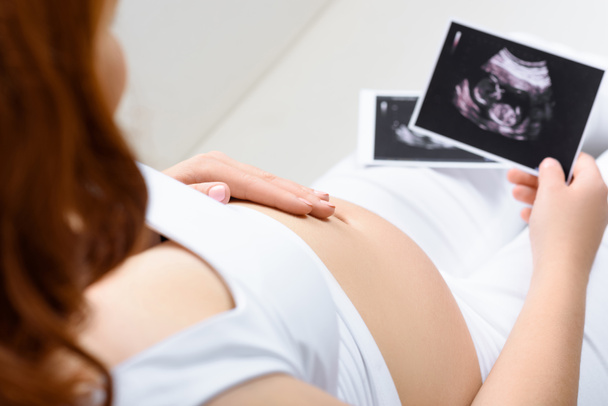 pregnant woman with ultrasound scans - Photo, Image