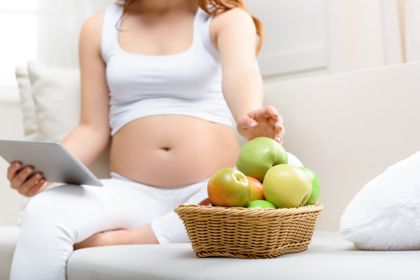 pregnant woman eating apples - Photo, Image