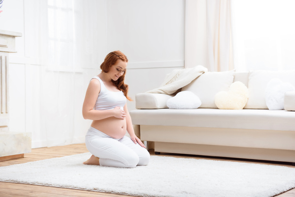 beautiful pregnant woman at home - 写真・画像