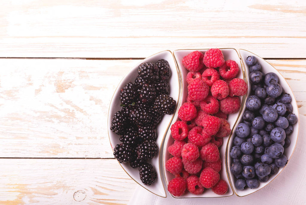 Raspberry, blackberry and blueberry. Healthy food. Top view - Photo, image
