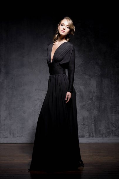 gorgeous young woman in black dress - Zdjęcie, obraz