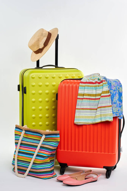 Closed suitcases and summer clothes. - Photo, Image