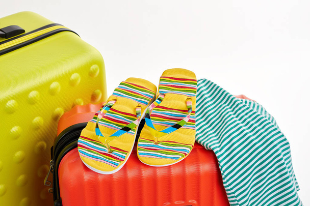 Flips, clothes, suitcases close up. - Photo, Image