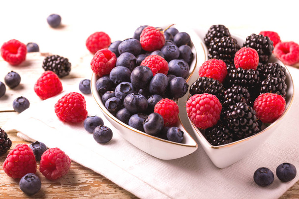 Raspberry, blackberry and blueberry. Healthy food. Top view - Zdjęcie, obraz