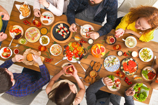 People eat healthy meals at served table dinner party - Photo, Image