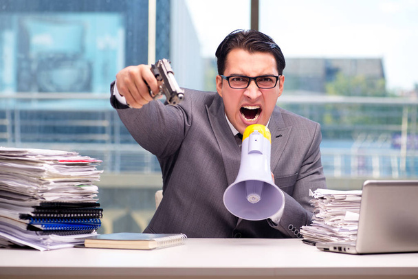Angry businessman with gun in the office - Photo, Image