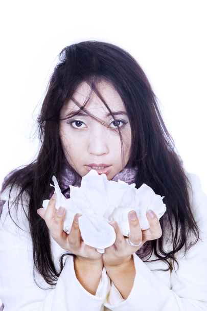 Asian girl holding tissue isolated in white - Fotó, kép