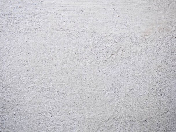 Textura de la masilla. Pared enlucida blanca con manchas y gotas en un primer plano de la superficie. Macro fotografía color textura de fondo
 - Foto, Imagen