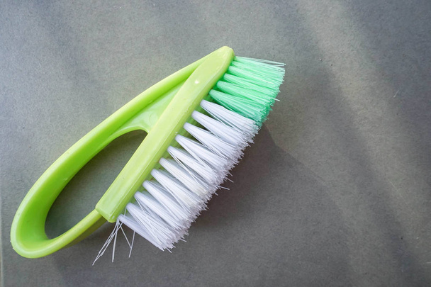 close up green washing brush on the floor - Foto, Imagen