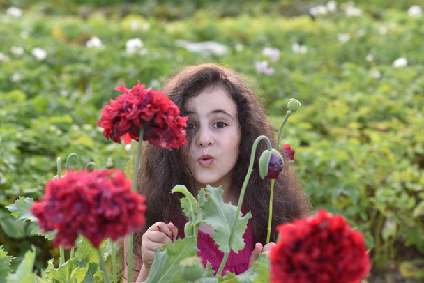 Girl  on nature and beautiful hair flower - Photo, Image