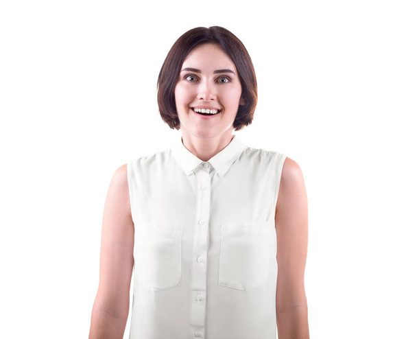 A woman is laughing and excited. A happy and crazy young woman isolated on a white background. A funny brunette and casual lady.  - Фото, зображення