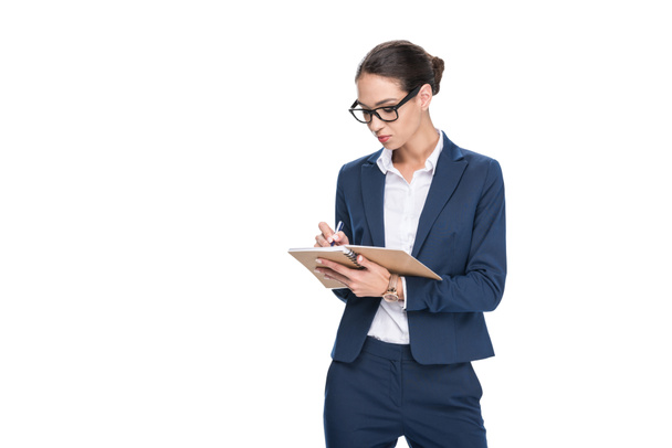businesswoman writing in diary - Photo, Image