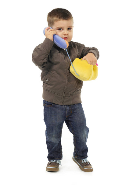 Lapsi puhuu puhelimessa - Valokuva, kuva