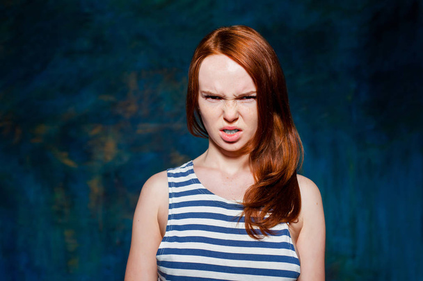 Angry redhead girl - Фото, изображение