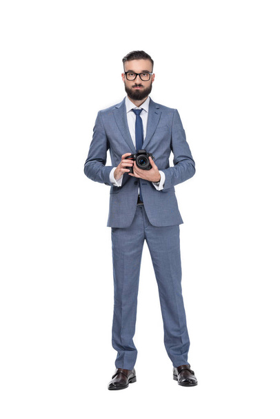 businessman holding camera - Foto, afbeelding