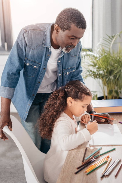 african american girl drawing with father - Photo, Image
