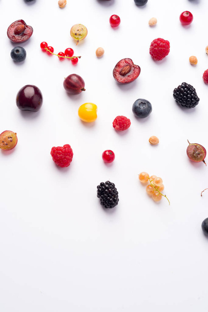 Mix of berries isolated over white background table. - Φωτογραφία, εικόνα