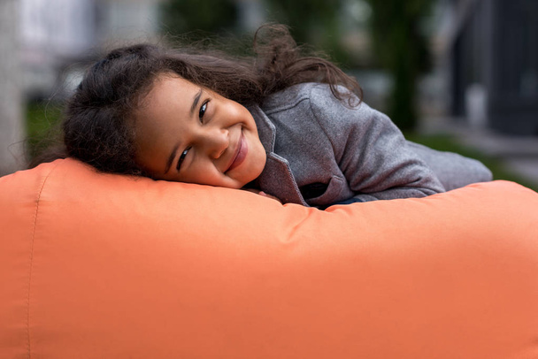 african american girl on bean bag chair - Photo, Image