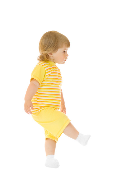 Walking girl in yellow shirt and pants - Foto, imagen