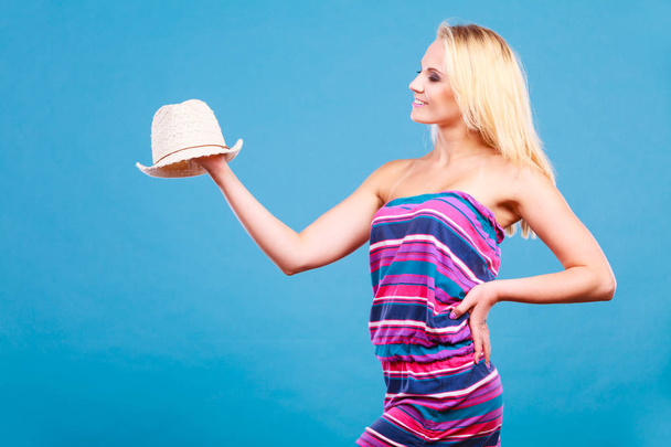 Blonde woman wearing short colorful striped dress - Foto, immagini
