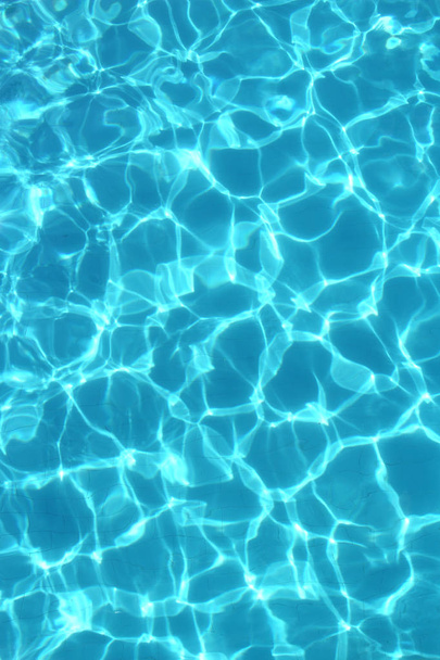Texture of  clear blue water in the swimming pool - Photo, Image