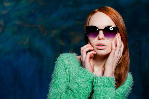 young beautiful redhead woman in sunglasses - Photo, image