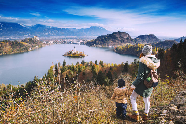 Traveling family looking on Bled Lake, Slovenia, Europe  - Φωτογραφία, εικόνα