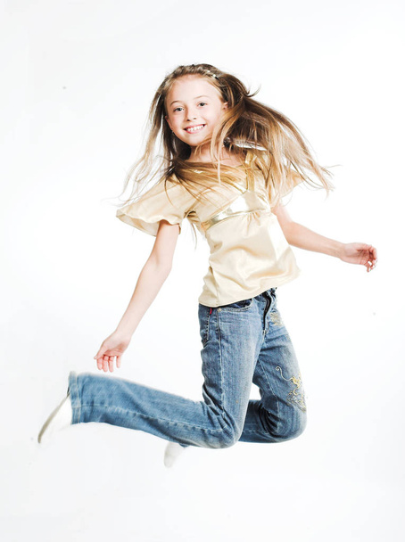 girl jumps on a white background - Fotografie, Obrázek