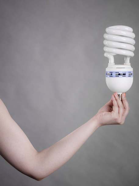 Woman holding eco modern light bulb - Foto, Bild