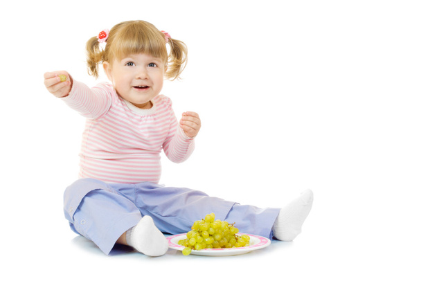 Little girl with grapes - Фото, зображення