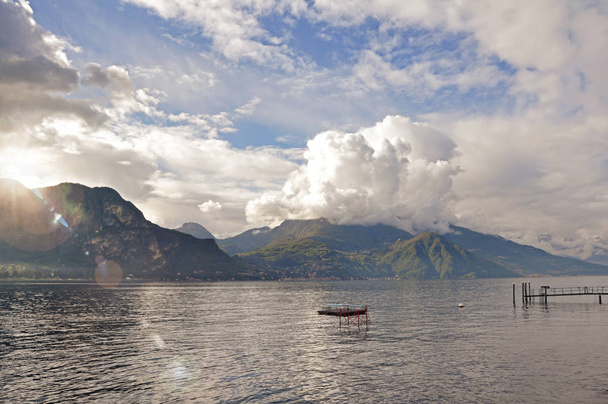View of Lake Como in a cloudy day with sunshine in Bellagio - Фото, изображение