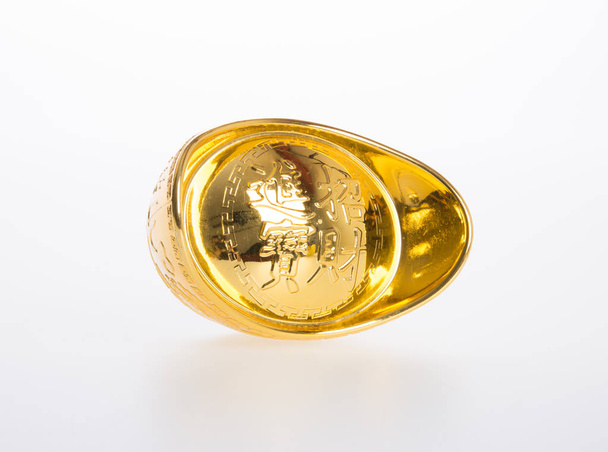 Gold or Chinese gold ingot mean symbols of wealth and prosperity - Valokuva, kuva