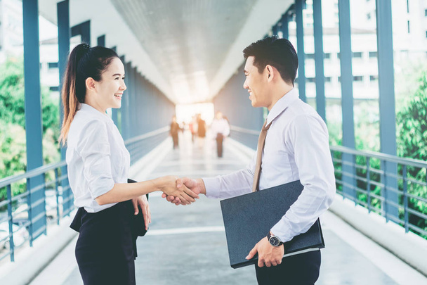 Business partnership handshaking after striking deal outdoors at - Фото, изображение
