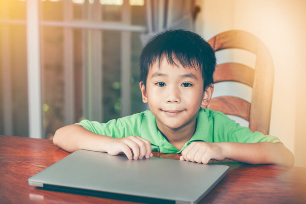 Asian boy used modern generation technology with laptop computer. - Photo, Image