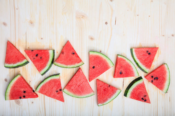 Watermelon pieces on a wooden board - Foto, imagen