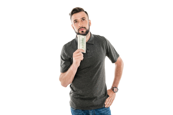 pensive man with dollar banknote - Foto, afbeelding