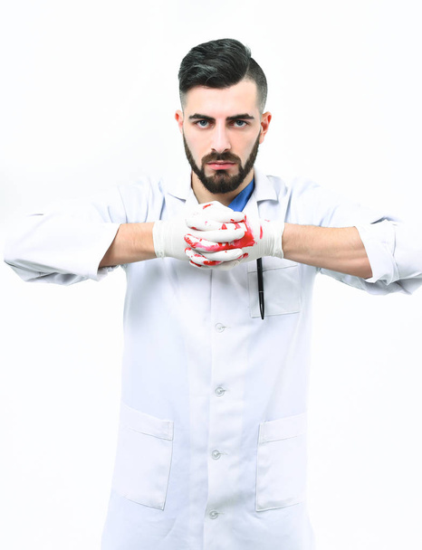 Man with beard in medical uniform. Surgery and treatment concept. - Fotó, kép